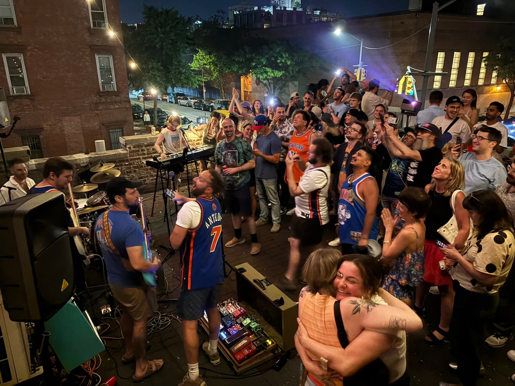 Shagshop Rooftop surrounded by a dancing crowd at a Williamsburg rooftop show
